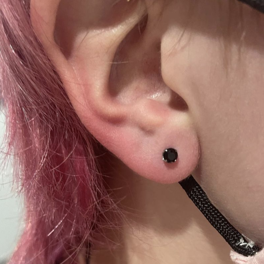 Ear piercing by Austin O'Rourke