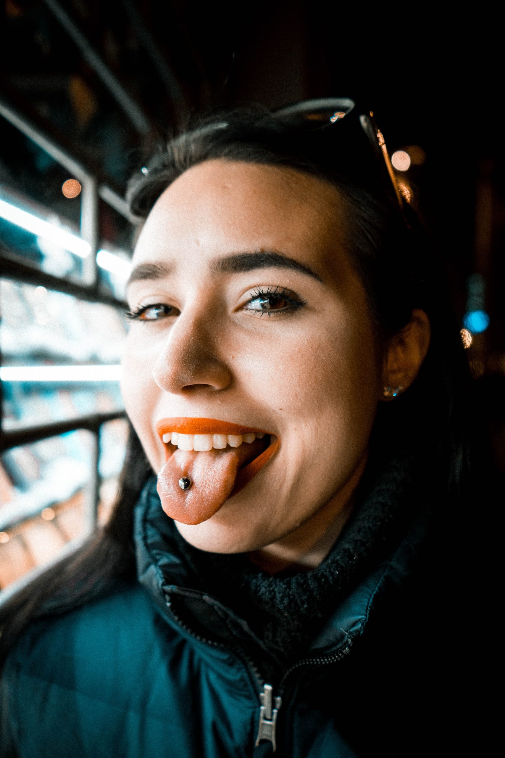 Photo of a woman with a tongue piercing