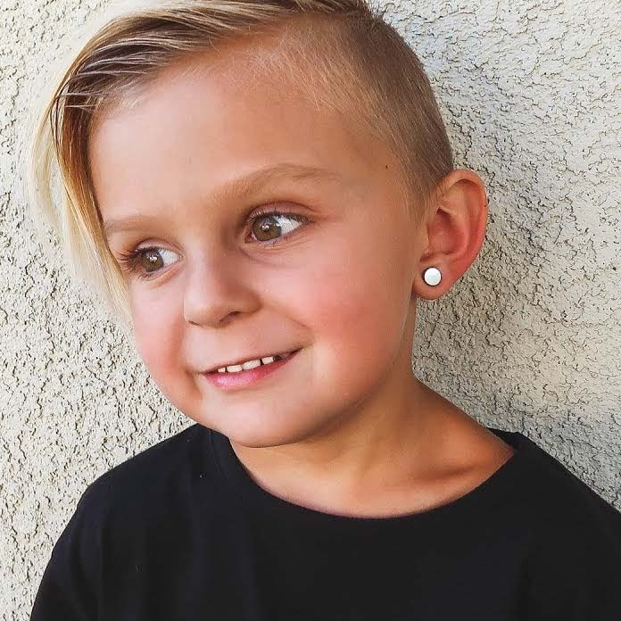 Photo of a boy with an ear piercing